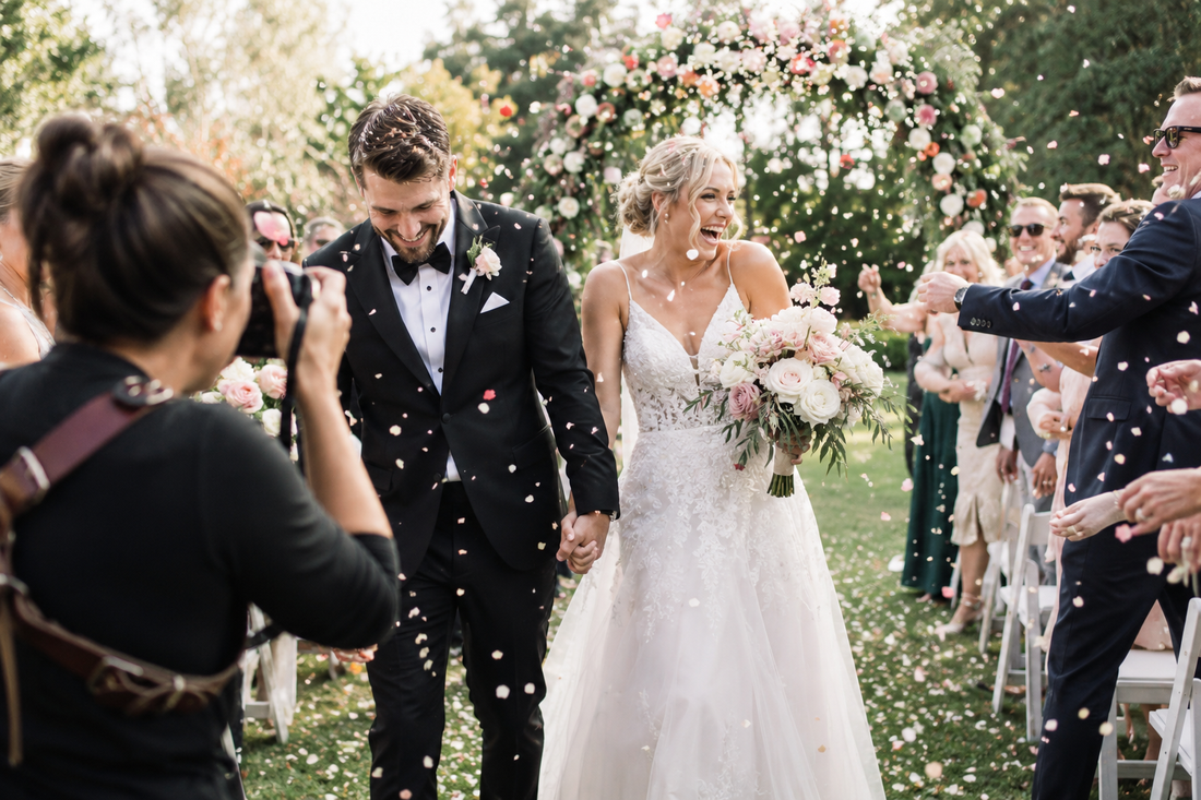 Confetti throw of a newly wed couple