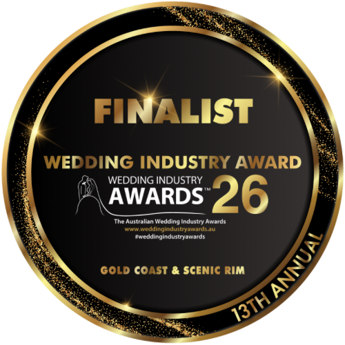 A circular black and gold badge reading 'FINALIST WEDDING INDUSTRY AWARD 26' with 'GOLD COAST & SCENIC RIM' and '13TH ANNUAL' on a white background.