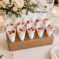Decorative cones with flowers on a table setting